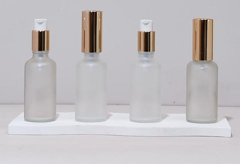 50Ml Glass Bottle With Gold Treatment Pump (Round)